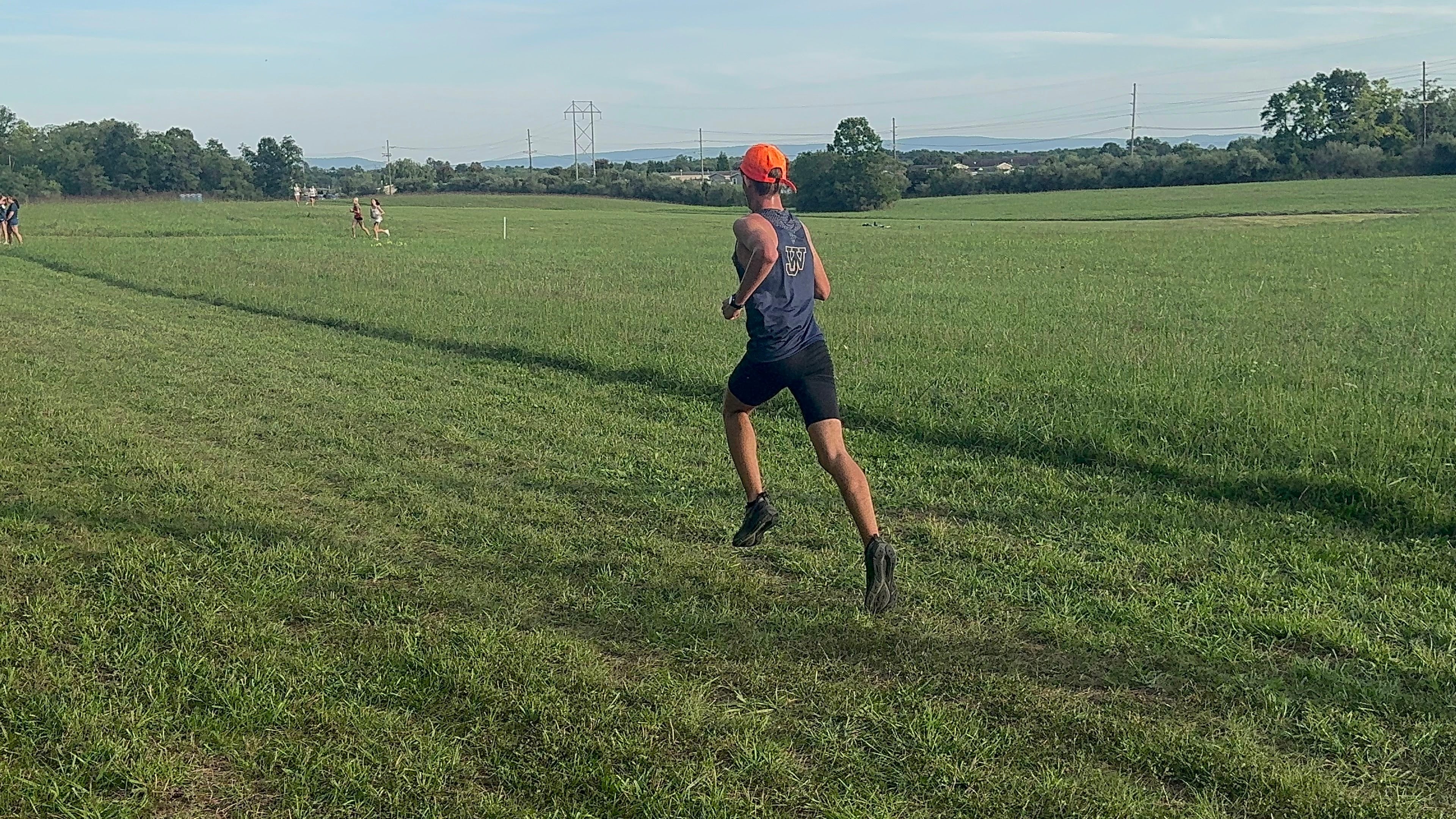 CRESCO founder running through grass during distance training