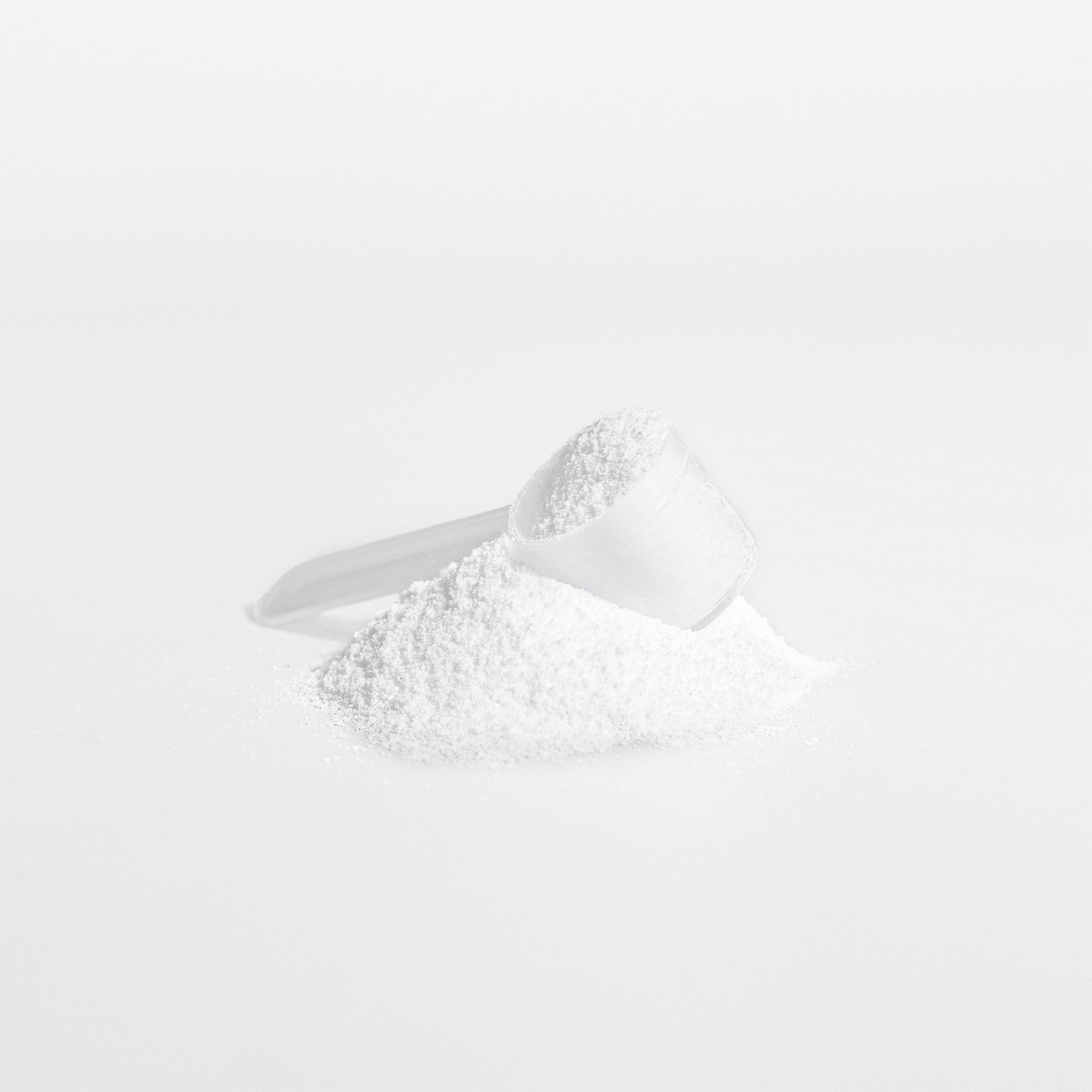 Pure creatine monohydrate powder close-up